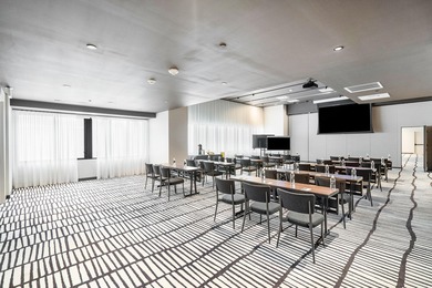 By combining the local atmosphere of a homestay with the service