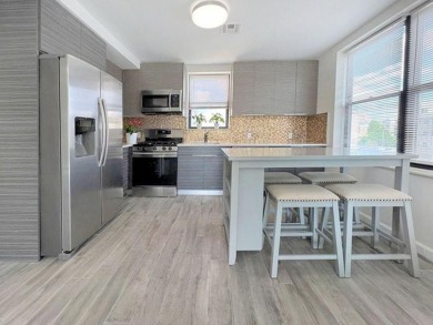 Welcome to this stunning duplex 3-bedroom, 3-bath penthouse with