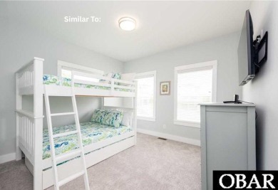 Experience the pinnacle of coastal living with 914 Sea Ridge, a