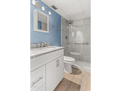 Stunning three bedroom remodeled end unit with panoramic water