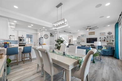 Welcome to this exceptional elevated Key West style 4-bedroom