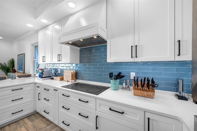 Welcome to this exceptional elevated Key West style 4-bedroom