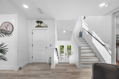 Welcome to this exceptional elevated Key West style 4-bedroom