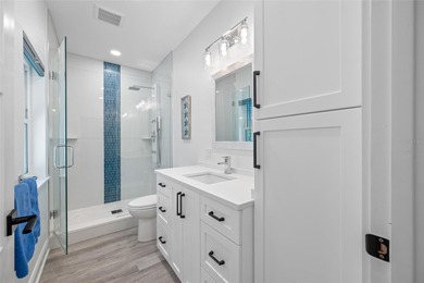 Welcome to this exceptional elevated Key West style 4-bedroom