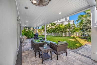 Welcome to this exceptional elevated Key West style 4-bedroom
