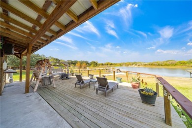 THE ULTIMATE LAKEFRONT HOME! Located in the highly sought-after