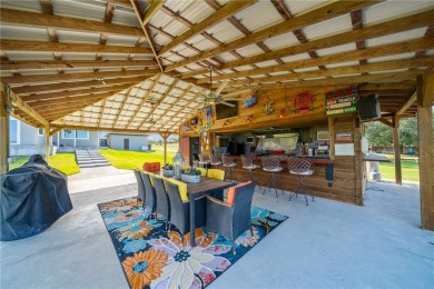 THE ULTIMATE LAKEFRONT HOME! Located in the highly sought-after