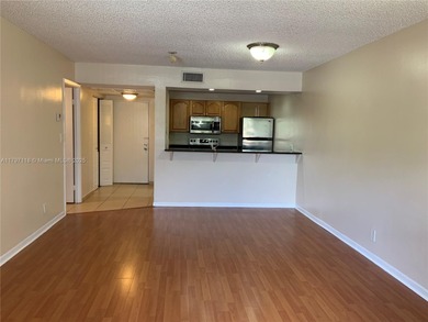 This lovely one-bedroom corner unit features granite tops