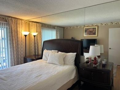 Beautiful 2 bedroom condo with a covered screened porch with new