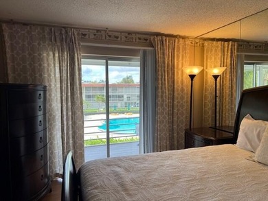 Beautiful 2 bedroom condo with a covered screened porch with new