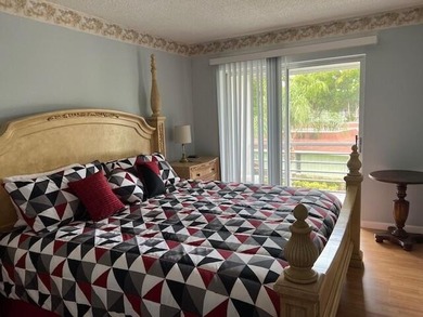 Beautiful 2 bedroom condo with a covered screened porch with new