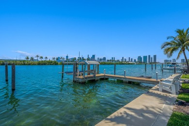 Experience unrivaled waterfront luxury at 210 Palm Avenue, a
