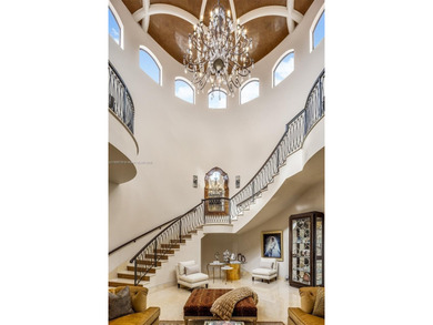 Experience unrivaled waterfront luxury at 210 Palm Avenue, a