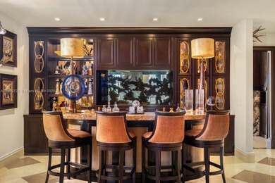 Experience unrivaled waterfront luxury at 210 Palm Avenue, a