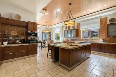 Experience unrivaled waterfront luxury at 210 Palm Avenue, a