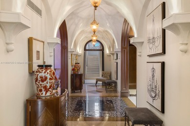 Experience unrivaled waterfront luxury at 210 Palm Avenue, a