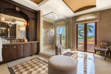 Experience unrivaled waterfront luxury at 210 Palm Avenue, a