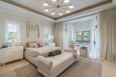 Experience unrivaled waterfront luxury at 210 Palm Avenue, a