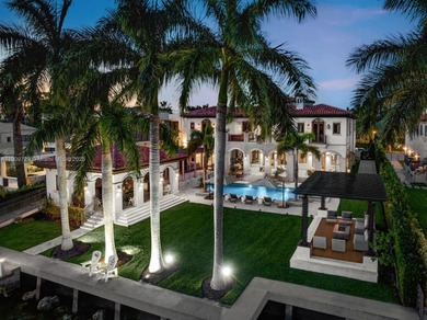 Experience unrivaled waterfront luxury at 210 Palm Avenue, a