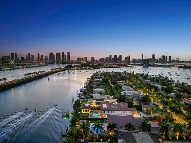 Experience unrivaled waterfront luxury at 210 Palm Avenue, a
