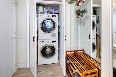 This SW CORNER unit has floor-to-ceiling windows and doors