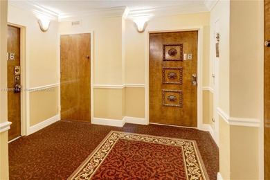 This SW CORNER unit has floor-to-ceiling windows and doors