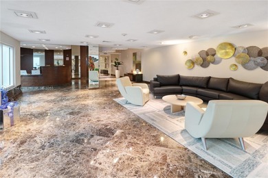 This SW CORNER unit has floor-to-ceiling windows and doors