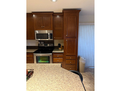 Welcome to your new home in a GATED 55+ community, offering the