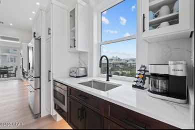 A SHOWSTOPPER of a home! Located in Secluded Dunes subd. This