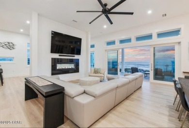 A SHOWSTOPPER of a home! Located in Secluded Dunes subd. This