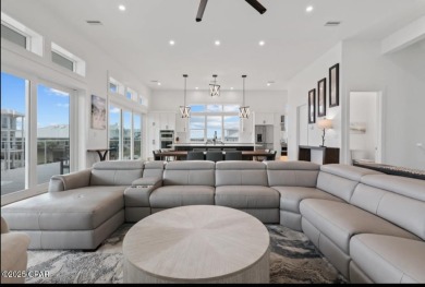 A SHOWSTOPPER of a home! Located in Secluded Dunes subd. This