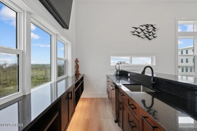 A SHOWSTOPPER of a home! Located in Secluded Dunes subd. This