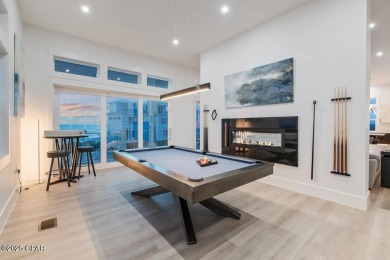 A SHOWSTOPPER of a home! Located in Secluded Dunes subd. This