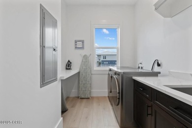 A SHOWSTOPPER of a home! Located in Secluded Dunes subd. This