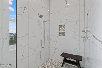 A SHOWSTOPPER of a home! Located in Secluded Dunes subd. This