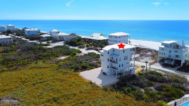 A SHOWSTOPPER of a home! Located in Secluded Dunes subd. This