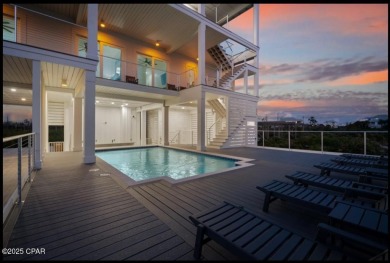 A SHOWSTOPPER of a home! Located in Secluded Dunes subd. This