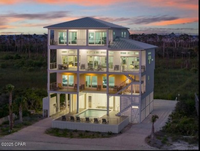 A SHOWSTOPPER of a home! Located in Secluded Dunes subd. This