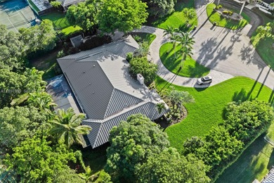 Tucked away on a private cul-de-sac in Pine Bay Estates, this