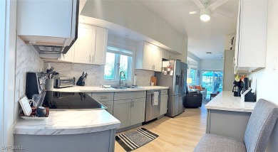 This BOATER'S DREAM offers coveted deep-water access five houses