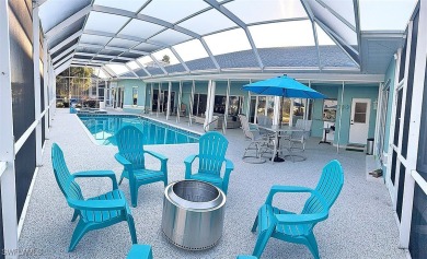 This BOATER'S DREAM offers coveted deep-water access five houses