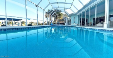 This BOATER'S DREAM offers coveted deep-water access five houses