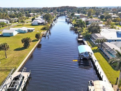 This BOATER'S DREAM offers coveted deep-water access five houses