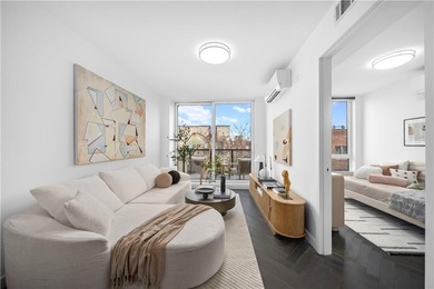 Modern Condo Living with 2 Outdoor Spaces and Deeded Parking in