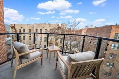 Modern Condo Living with 2 Outdoor Spaces and Deeded Parking in