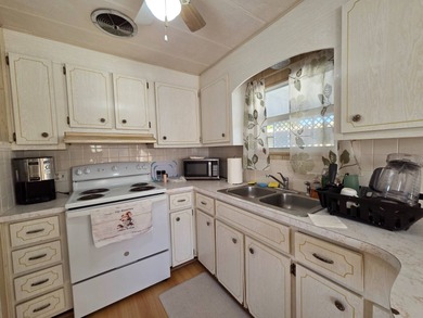 This 2 bed 1.5 bath home is located in Teakwood Village a 5 star