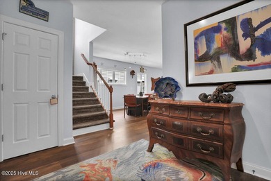 Just a short walk to public beach access, this beautifully