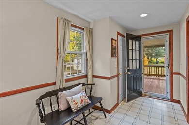 Nestled in the desirable Warwick Neck community, this inviting