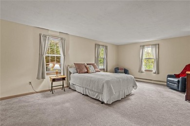 Nestled in the desirable Warwick Neck community, this inviting