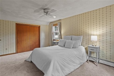 Nestled in the desirable Warwick Neck community, this inviting